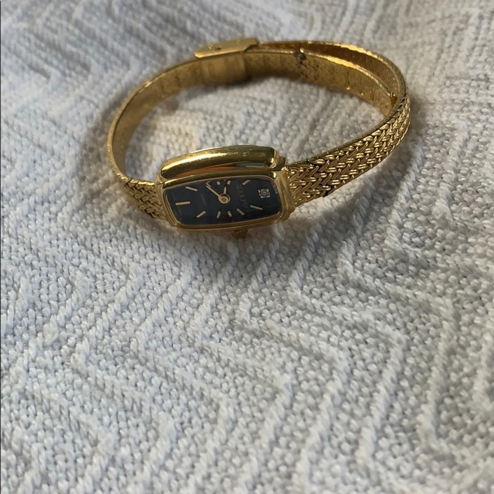 gold adolfo watch
